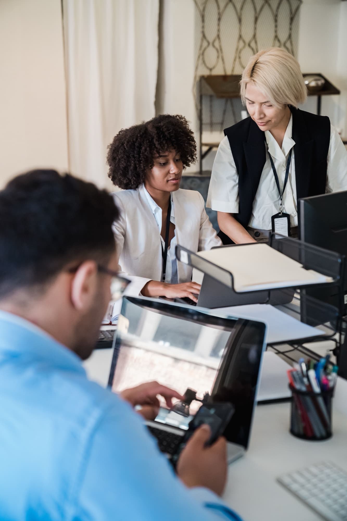 Advisory team collaborating around a desk in an office