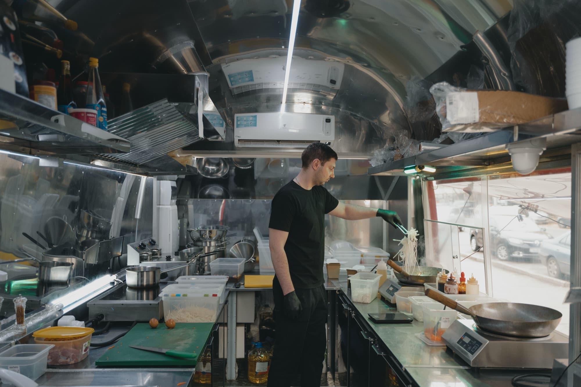 Chef preparing dishes in a busy commercial kitchen