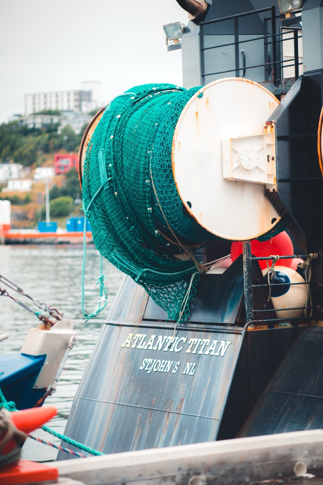 Commercial fishing vessel with nets at the harbour