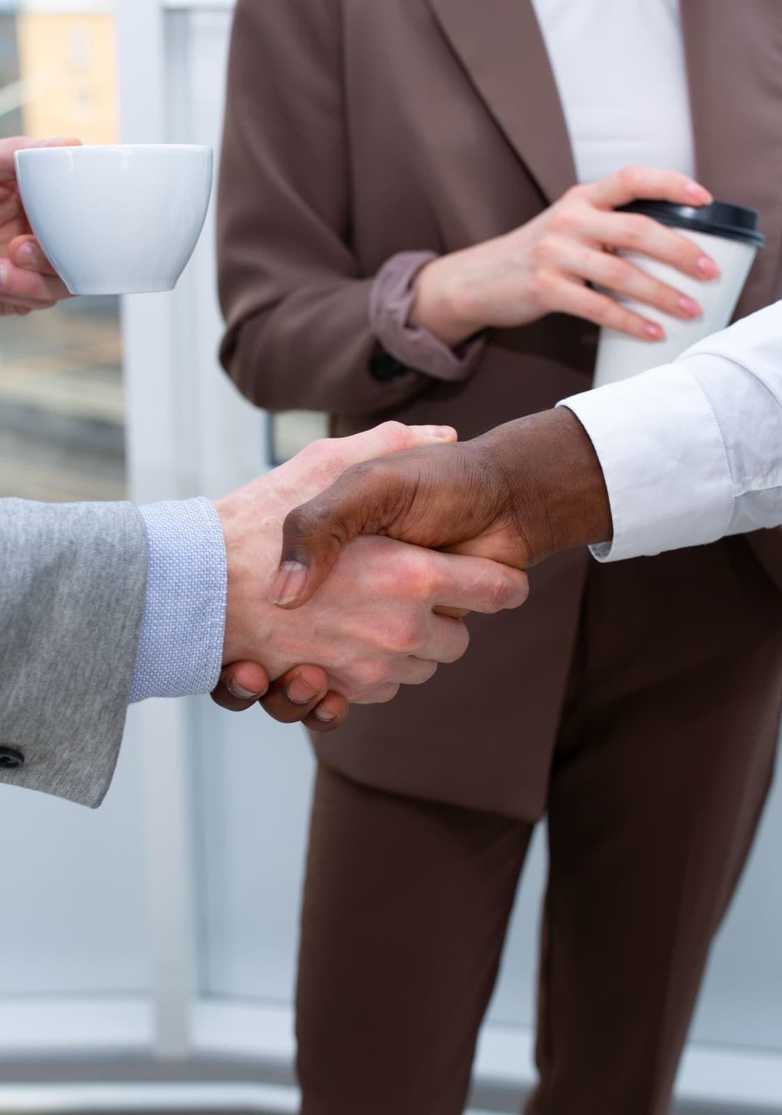 Business partners shaking hands after an agreement