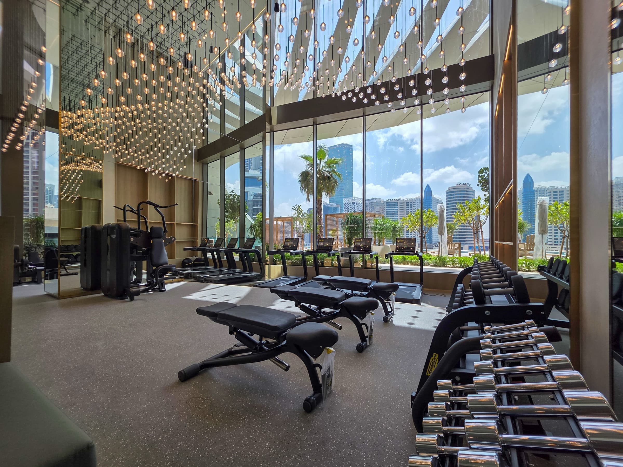 Luxury gym with city views and premium fitness equipment