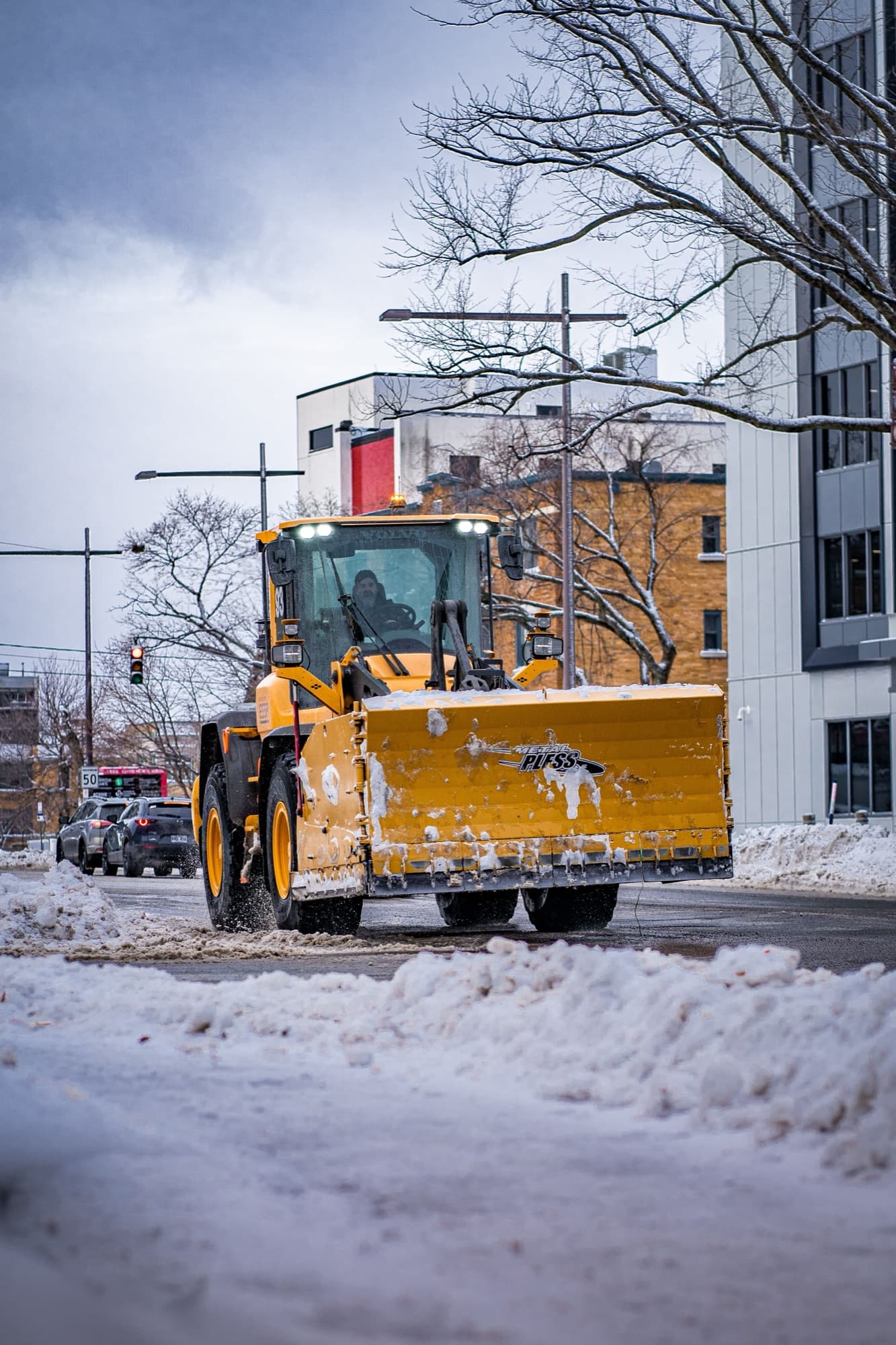 Heavy equipment loader working on a city street