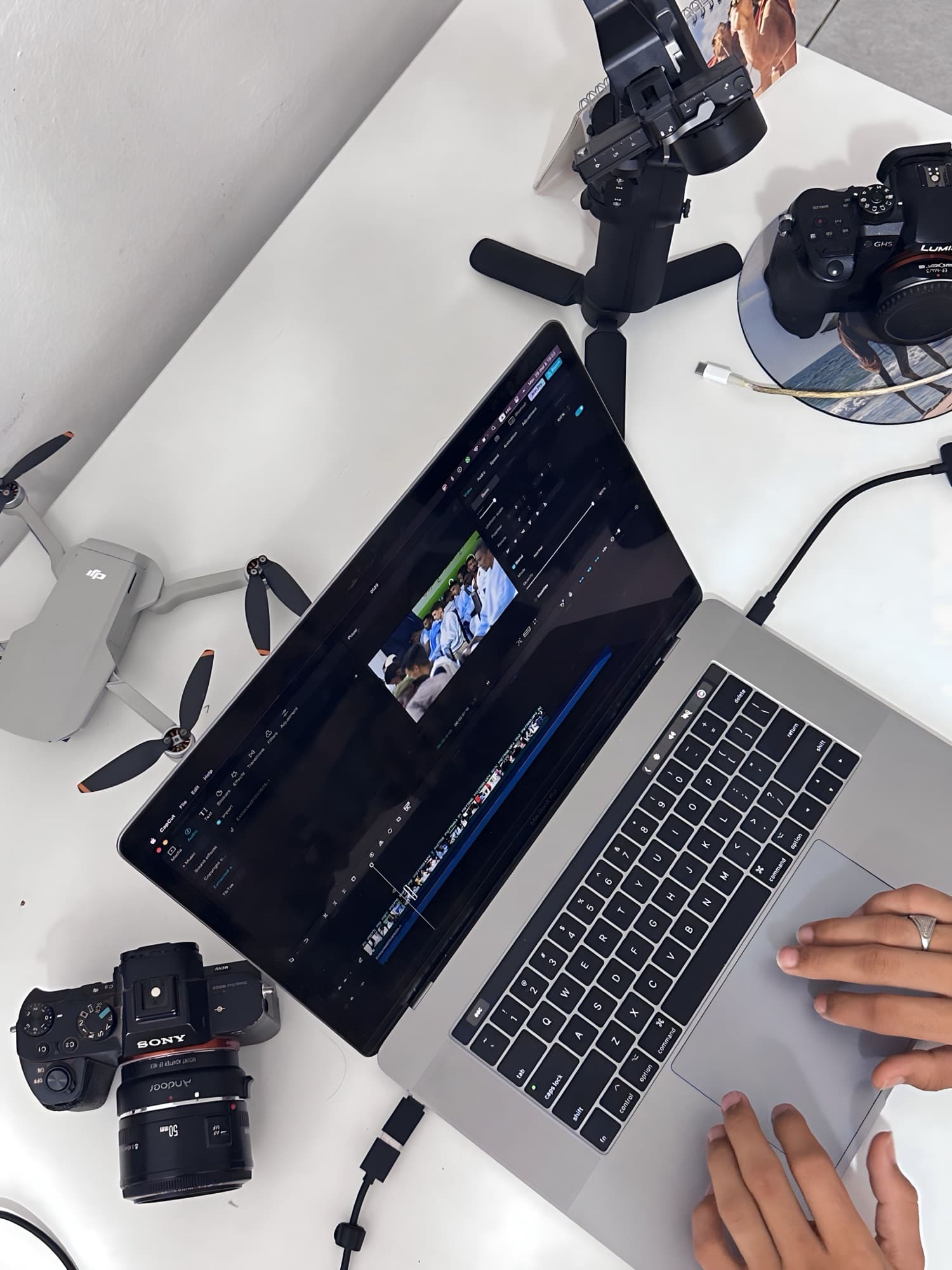 Laptop and cameras on a creative production workstation