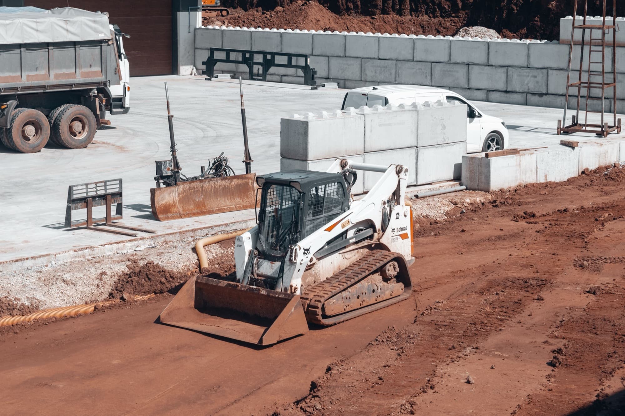 Compact loader working on an active construction site